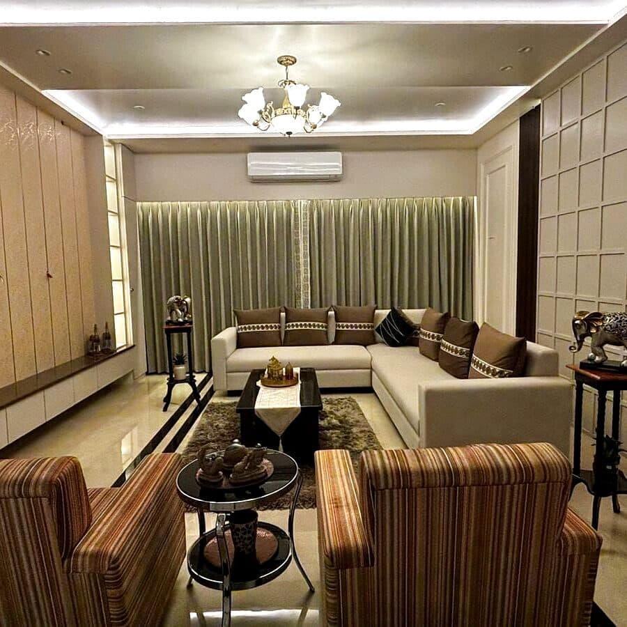 Floor-length drapes with a sheer layer in a Jorhat home