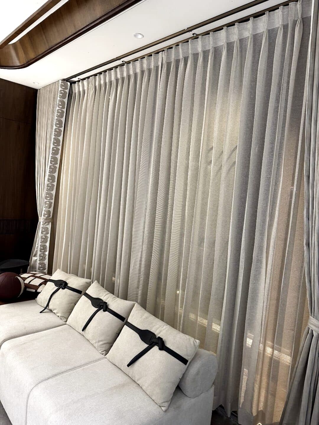Floor-length drapes with a sheer layer in a Jorhat home